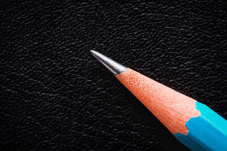 simple pencil macro on a black texture surfaceの写真素材