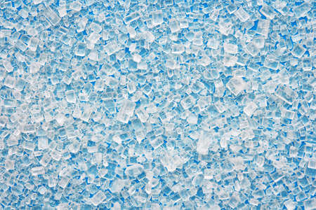 sugar scattered on a bright blue backgroundの写真素材