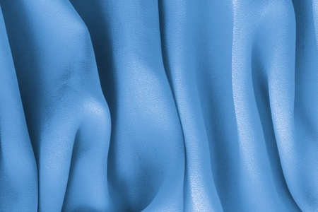 blue fabric with large folds,  abstract backgroundの写真素材