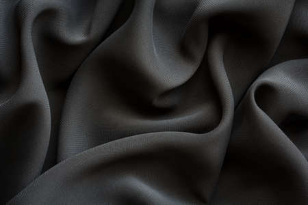 black fabric with large folds,  abstract background
