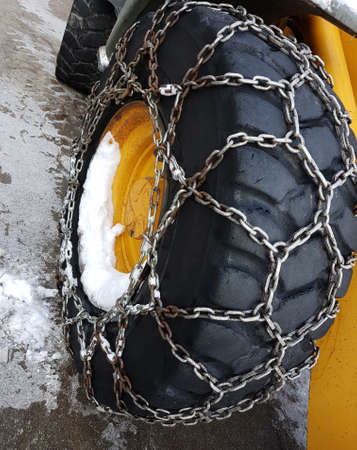snow chain on the wheel in winter