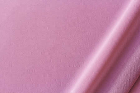 lilac fabric with large diagonal folds, textile backgroundの写真素材