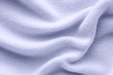 delicate blue cashmere, texture knitted fabric with large foldsの写真素材
