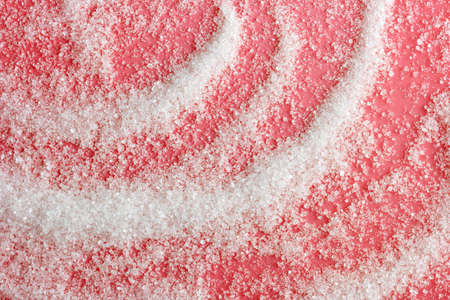 sugar scattered on a pink backgroundの写真素材