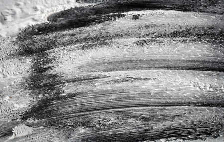 white shaving foam texture on black backgroundの写真素材