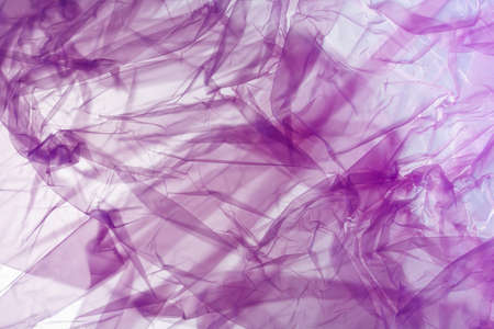 abstract background, crumpled purple plastic bagの写真素材