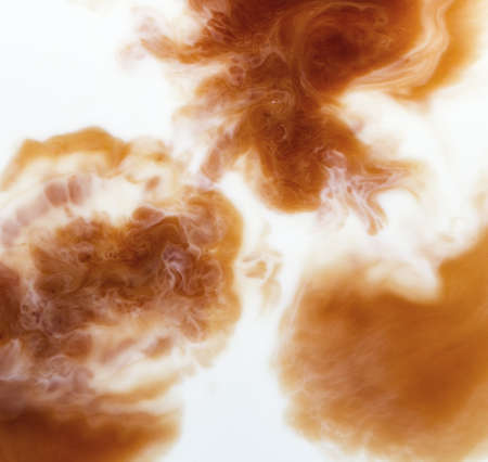 mixing coffee with milk, macroの写真素材