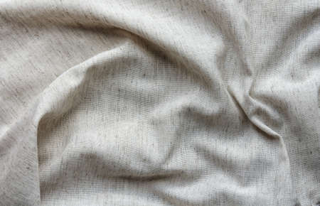 natural crumpled linen fabric as textile backgroundの写真素材