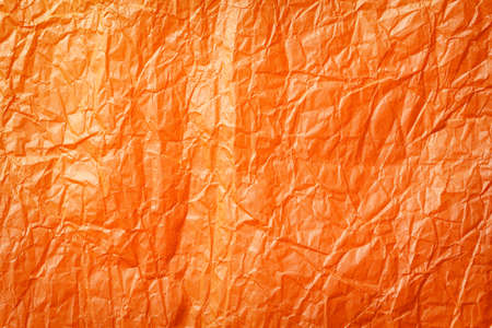 texture of orange wax crumpled paperの写真素材