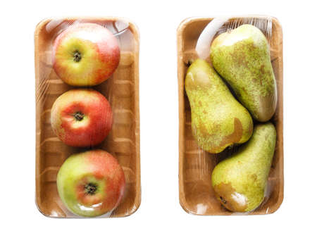 apples and pears packaged in cardboard containers wrapped in cling film for retail sale, isolated on whiteの写真素材