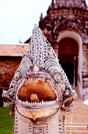 Naga guarding the entrance to a Temple の写真素材