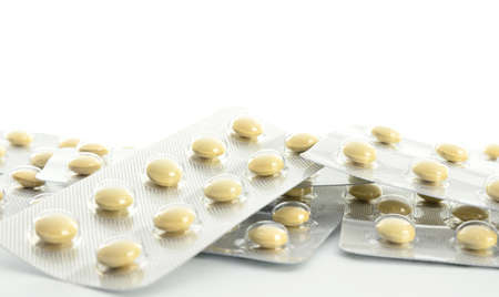 Pills in blister packs on white backgroundの写真素材