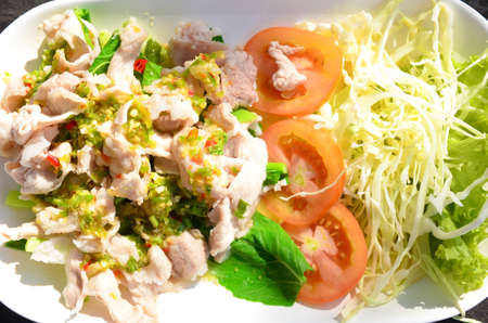 Pork topped spicy sauce and garlicの写真素材
