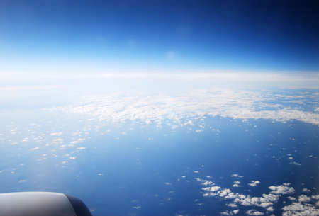 Air space with white clouds and blue sky views by the plan