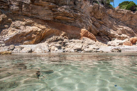 A transparency sea with a rocks の写真素材