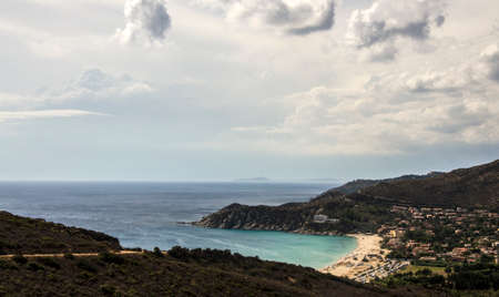 A costal landscape with sea, beach and a cloudy skyの写真素材