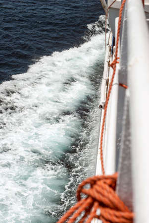 view of the sail with waves crashing on the shipの写真素材