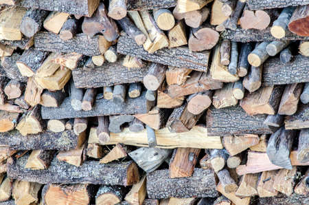 Wooden logs for the fireplace in winter の写真素材
