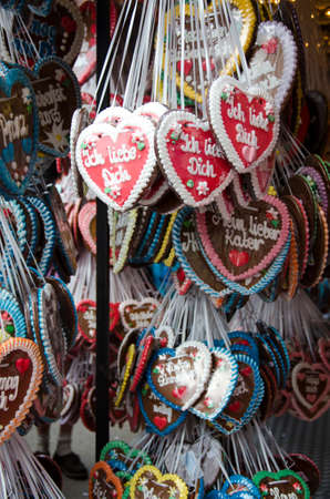 chocolate hearts stand in all colors with inscriptions in German fot octoberferstの写真素材