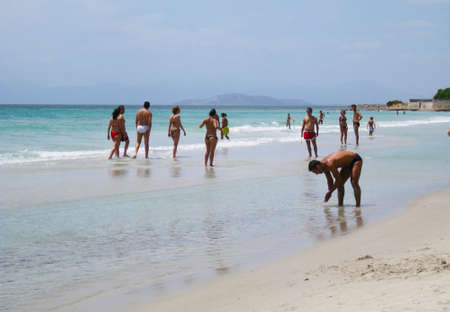 Capitana's Beach, Italy-AUGUST 25: Unidentified people in white beach with blue crystal sea and waves in summertime on August 25.2010 in Capitana, Italy as editorialのeditorial素材