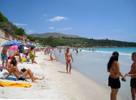 Capitana's Beach, Italy-AUGUST 25: Unidentified people in white beach with blue crystal sea and waves in summertime on August 25.2010 in Capitana, Italy as editorialのeditorial素材