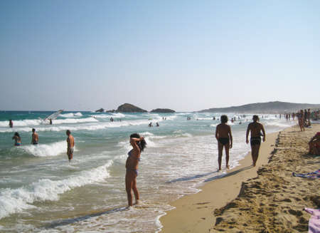 people in white beach with blue crystal sea in summertime at Chia as editorialのeditorial素材