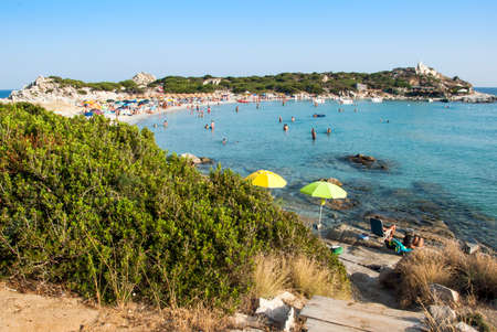 Summer scene with unidentified people in the white beach and blue sea in Villasimius (Sardinia) in Julyの写真素材