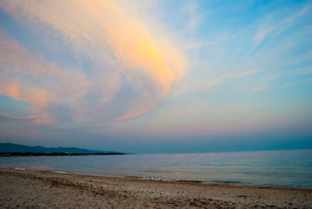 Colorful landscape at the beach with clouds and sunset colors in summertimeの写真素材
