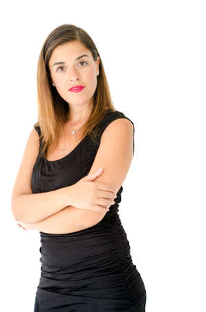Caucasian business woman posing in front of the camera with long hair, black dress and simple make up. Young adultの写真素材