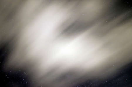 Sky in the night with stars and clouds blurry beccause they are in long exposure in summertimeの写真素材