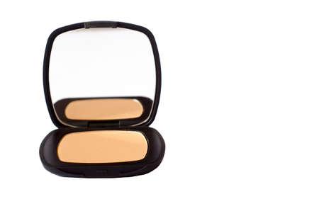 Macro of compact foundation with mirror isolated in white backgroundの写真素材