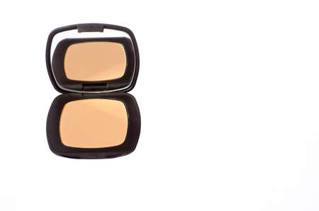 Macro of compact foundation with mirror isolated in white backgroundの写真素材