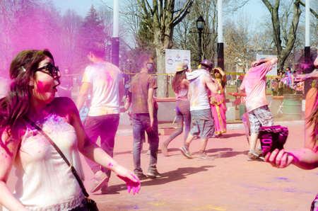London Ontario, Canada - April 16:  Portrait of unidentified young colorful people having fun at the Festival of Colours  on April 16.2016 in London Ontario, Canada as editorialのeditorial素材