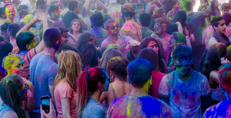 London Ontario, Canada - April 16:  Unidentified youg colorful people having fun at the Festival of Colours  on April 16.2016 in London Ontario, Canada as editorialのeditorial素材