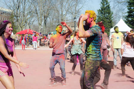 London Ontario, Canada - April 16:  Unidentified young colorful guys having fun and dancing at the Festival of Colours  on April 16.2016 in London Ontario, Canada as editorialのeditorial素材