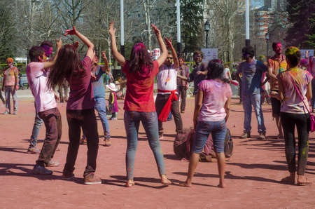London Ontario, Canada - April 16:  Unidentified young colorful people having fun and dancing at the Festival of Colours  on April 16.2016 in London Ontario, Canada as editorialのeditorial素材