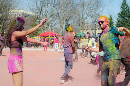 London Ontario, Canada - April 16:  Unidentified young colorful guys having fun and dancing at the Festival of Colours  on April 16.2016 in London Ontario, Canada as editorialのeditorial素材