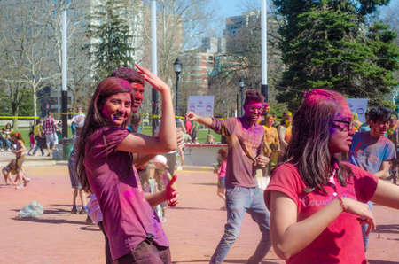 London Ontario, Canada - April 16:  Unidentified young colorful guys having fun and dancing at the Festival of Colours  on April 16.2016 in London Ontario, Canada  as editorialのeditorial素材