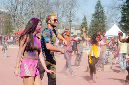 London Ontario, Canada - April 16:  Unidentified young colorful guys having fun and dancing at the Festival of Colours  on April 16.2016 in London Ontario, Canada as editorialのeditorial素材