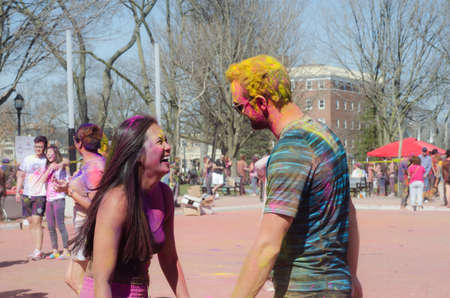 London Ontario, Canada - April 16:  Unidentified young colorful guys having fun and dancing at the Festival of Colours  on April 16.2016 in London Ontario, Canada as editorialのeditorial素材