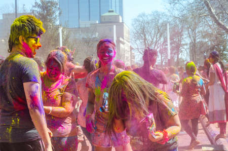 London Ontario, Canada - April 16: Unidentified young colorful people having fun and celebrating at the Festival of Colours on April 16.2016 in London Ontario, Canada as editorialのeditorial素材