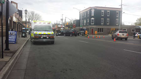 London Ontario, Canada - May 03, 2016: Firefighters and medical ambulance respond to a two vehicle accident with one car destroyed in the middle of the street as editorialのeditorial素材