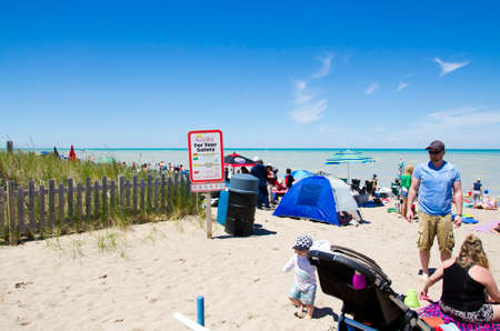 Grand Bend Ontario, Canada - July 02, 2016:  Unidentified people in the beach of Grand Bend  in leisure acivities in summertime as editorialのeditorial素材