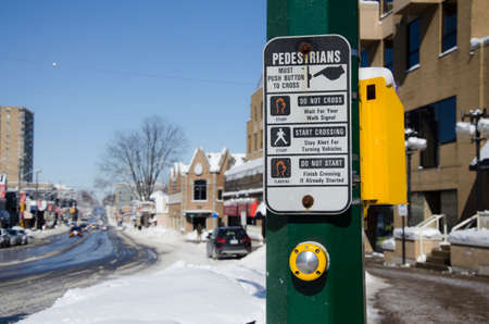 Pedestrian button and sign at a pedestrian crossing (North America)の写真素材