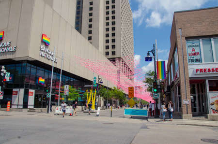 Montreal, Quebec, Canada - 18 July 2016: People strolling down Rue St Catherine in the Gay Village of Montreal.  Summertime and people in this pedestrian only street as editorialのeditorial素材