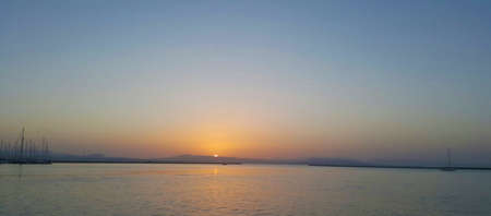 Sunset at the harbour in Italyの写真素材