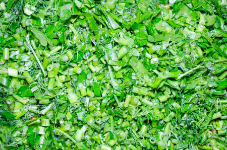 a few of finaly cut green dill and parsley close-up macro background herbsの写真素材