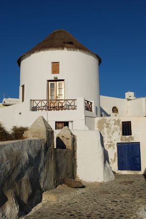 Beautiful Santorini landscape with white tower on blue sky backgroundの写真素材