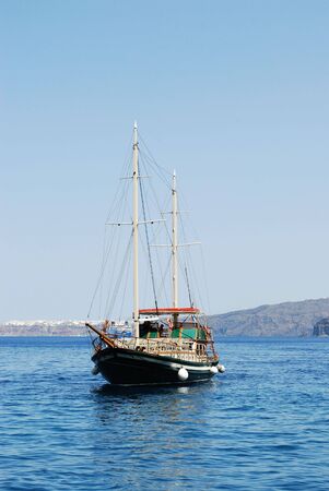 Greek boat near Santorini island, Greece の写真素材