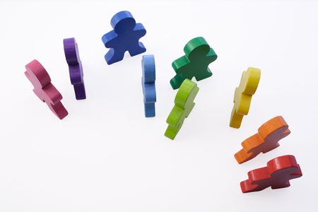 Workplace Diversity - Brightly colored wooden people standing together.の写真素材